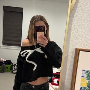 Black Off-Shoulder Sweater with White Bow